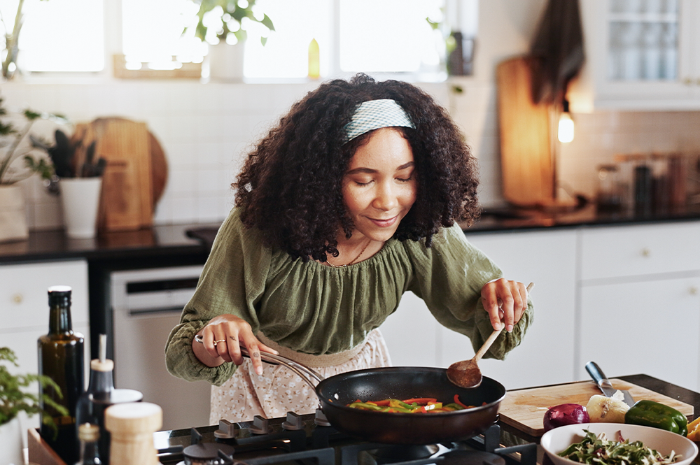 A lady cooking meal