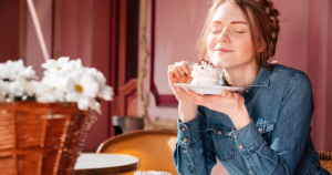 A girl smelling food