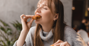 a woman eating cookies