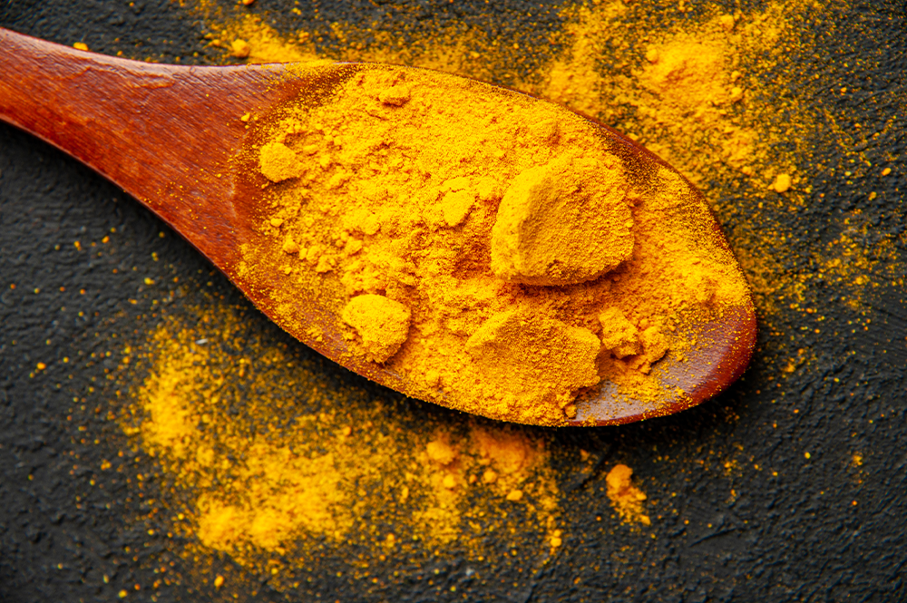 turmeric powder in a spoon